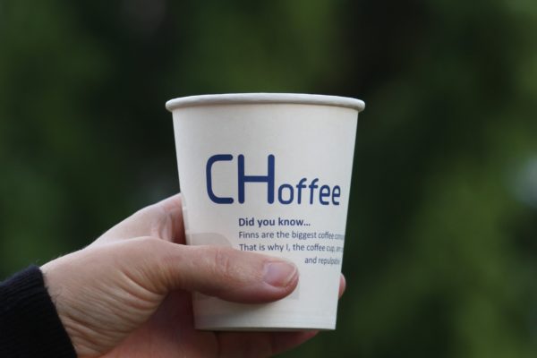 Hand holding a paper cup with the text "CHoffee"