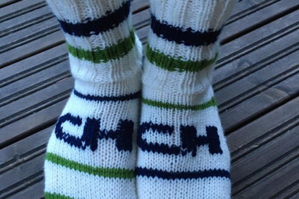 Knitted socks with CH-Polymers logo and colours